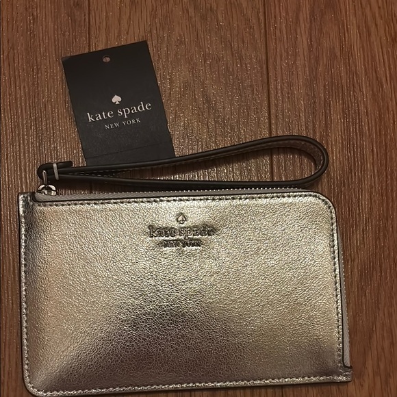 kate spade Handbags - Kate Spade Silver Wristlet